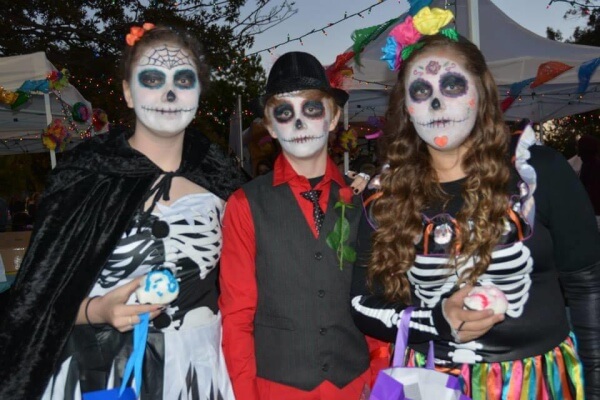 People celebrating Dia de los Muertos sometimes wear skeleton costumes and face paintings. (Larissa Murillo)