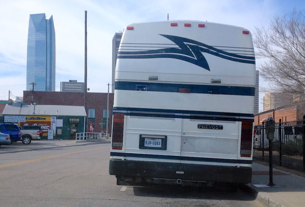 A tour bus waits in Bricktown. (William W. Savage III)