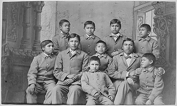 Boys in uniform after arriving at the Carlisle Indian Industrial School. (National Archives)