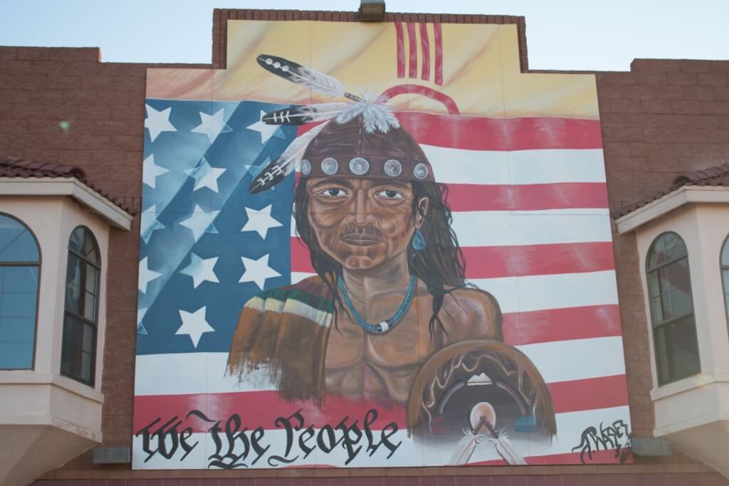 Mural of a Native American on the side of a trading post that sold goods from tribes on the Navajo Nation near Gallup, New Mexico. (Mike Lakusiak/News21)