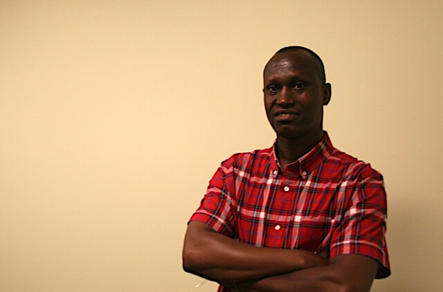 Desiré Nizigiyimana poses in his office in Austin. After fleeing from political violence in Burundi, he was granted a refugee status in Texas in 2012. (Alvaro Cespedes)
