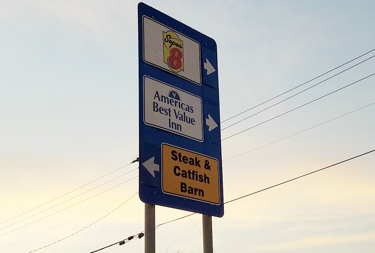 A sign along Hefner Road directs customers to the Steak & Catfish Barn along I-35. (Cheri Cooksey)