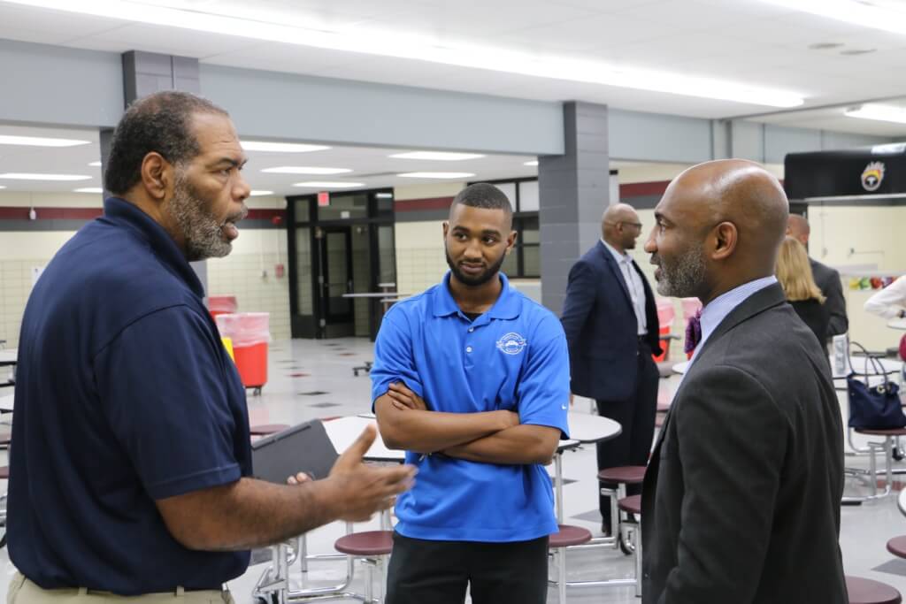 Errick Greene (right), chief of schools for Tulsa Public Schools, listens to concerns at a community forum at McLain High School. The school has experienced high principal turnover and is searching for new leader for the 2017-18 school year. (Brad Gibson, Oklahoma Watch)