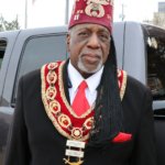 Shriner in distinctive red fez and regalia