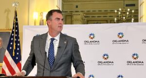Stitt lets budget bills become law without his signature