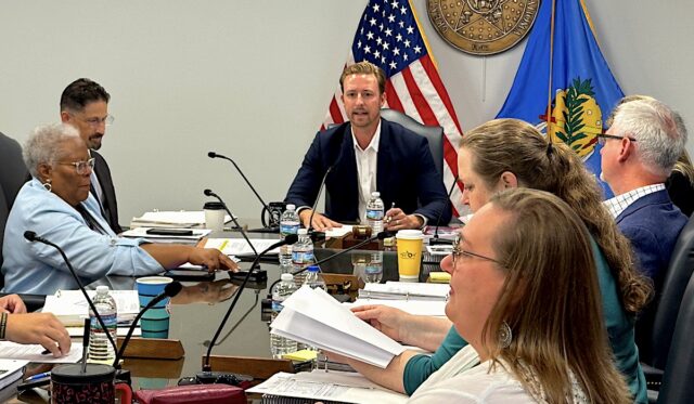 legislators attending a closed meeting